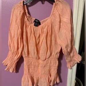 off shoulder pink top.